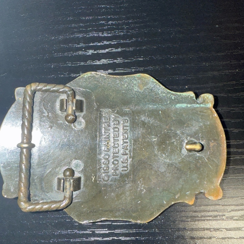 This pre-owned RainTree Big Horn Brass Belt Buckle